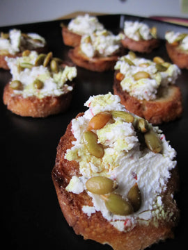 Goat Cheese Crostini with Pumpkin Seeds and Butternut Squash Seed Oil